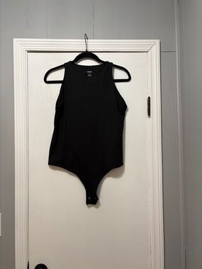 Sleeveless Black Ribbed Bodysuit with Snap Closure